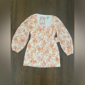 We Are Kindred 100% cotton long sleeve mini lace dress with square neckline.